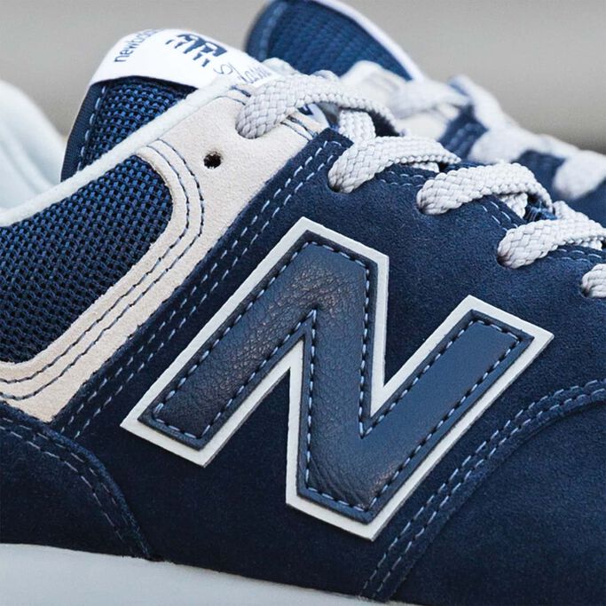 Close up of N logo on navy blue 574